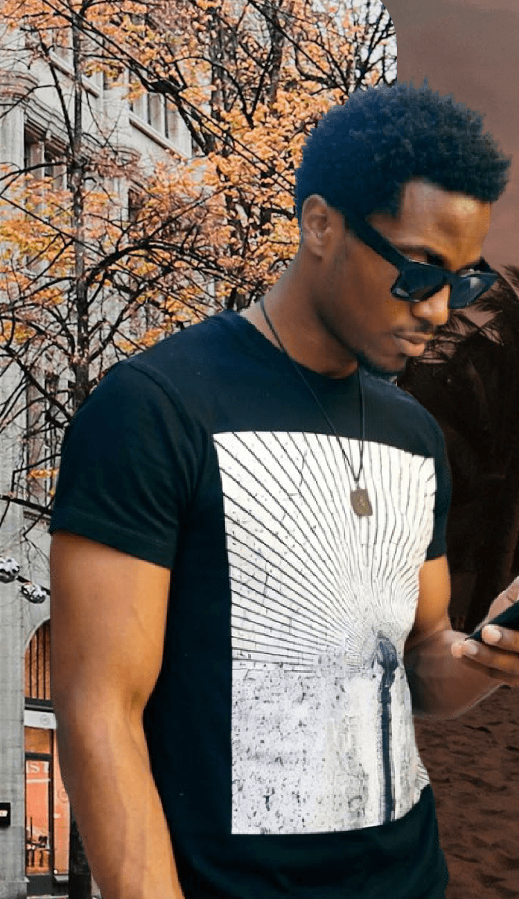 A man talking on his phone on a city street